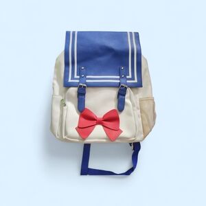 Blue and Cream Backpack with Red Bow